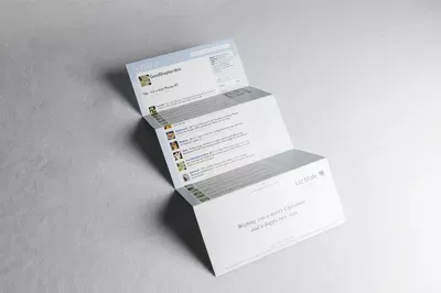 Three white LMC Christmas cards arranged in a fanned display on a gray surface, showcasing a minimalist design with gray accents and text elements.