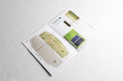 Four Christmas card design samples arranged on white paper, featuring minimalist layouts with cream, gold, green, and navy color schemes and subtle textured elements.