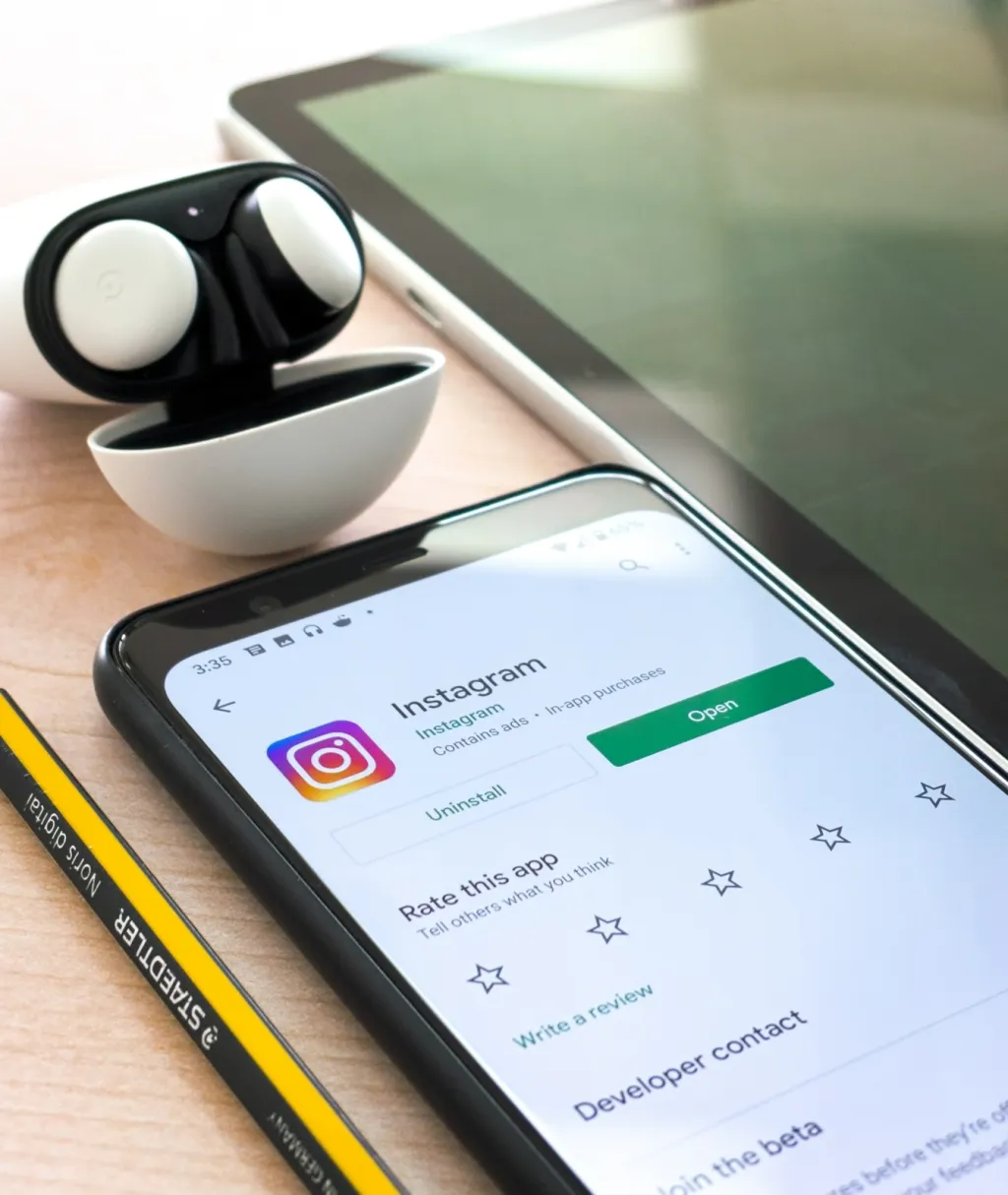 A smartphone displays the Instagram app store page with an 