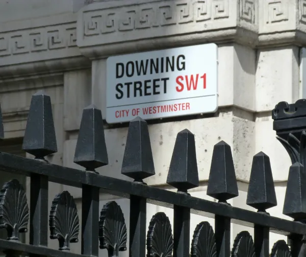 A white street sign reading 