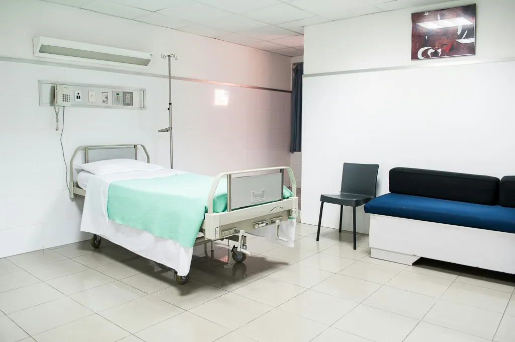 image of hospital bed and guest seating