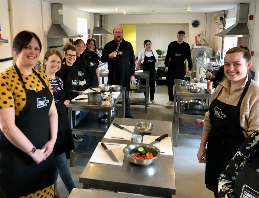 An image from our away day where we updated the team on the business plan and had a cooking masterclass with a former Masterchef finalist