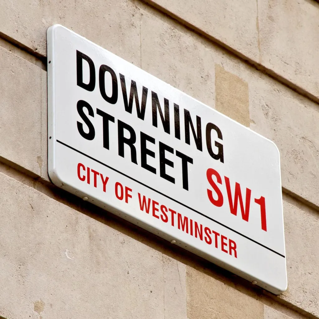 A white street sign reading 