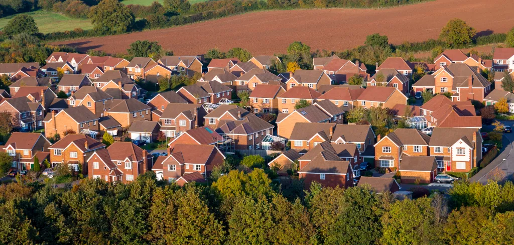 A large estate with multiple houses with pitched-roofs.