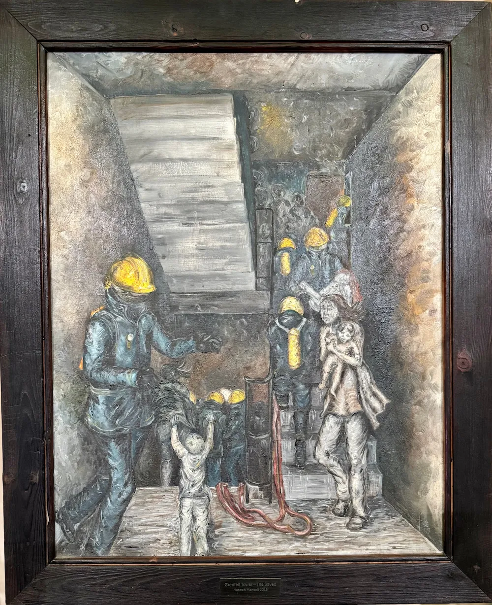 A painted illustration depicts firefighters in protective gear and hard hats inside a narrow stairwell, with one figure holding a hose and others positioned on the stairs amid shadowy, deteriorating walls lit by an overhead opening.